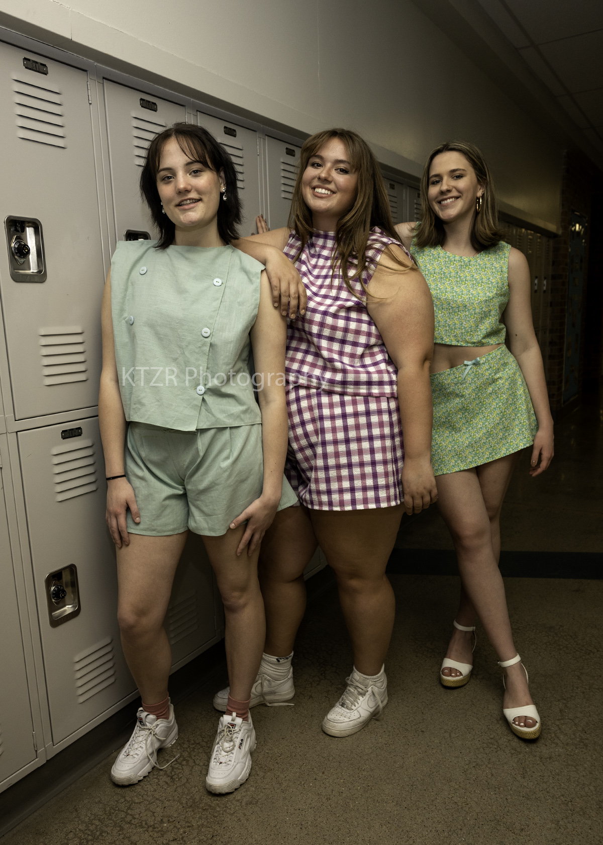 Ellie Klish, center, with her two models wearing easy summer twin sets made of second-hand textiles.